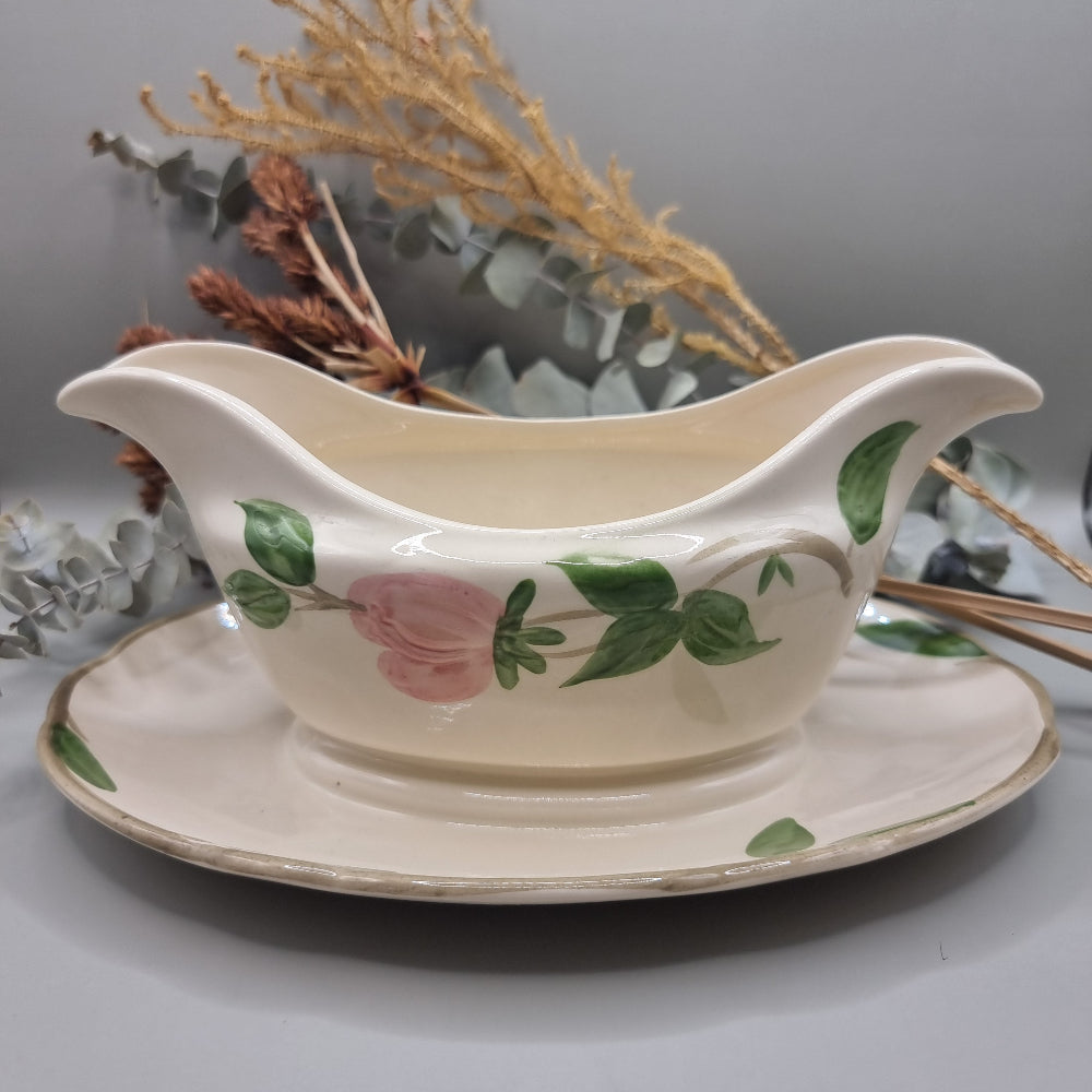 Franciscan “Desert Rose” gravy boat with pink floral pattern and attached underplate.