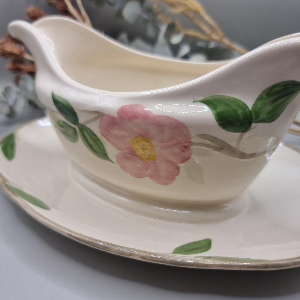 Franciscan “Desert Rose” gravy boat with pink floral pattern and attached underplate.