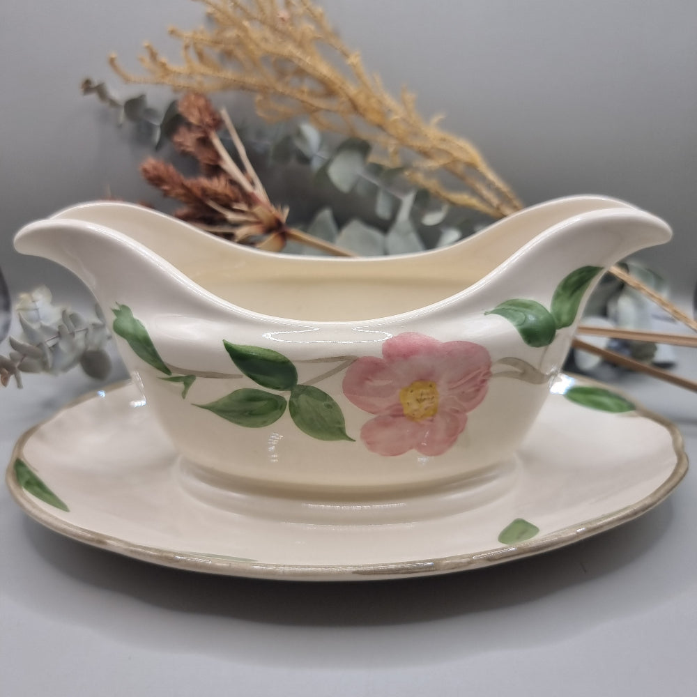 Franciscan “Desert Rose” gravy boat with pink floral pattern and attached underplate.