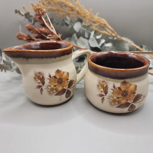 NZ stoneware creamer and sugar set with brown floral design and glaze rim