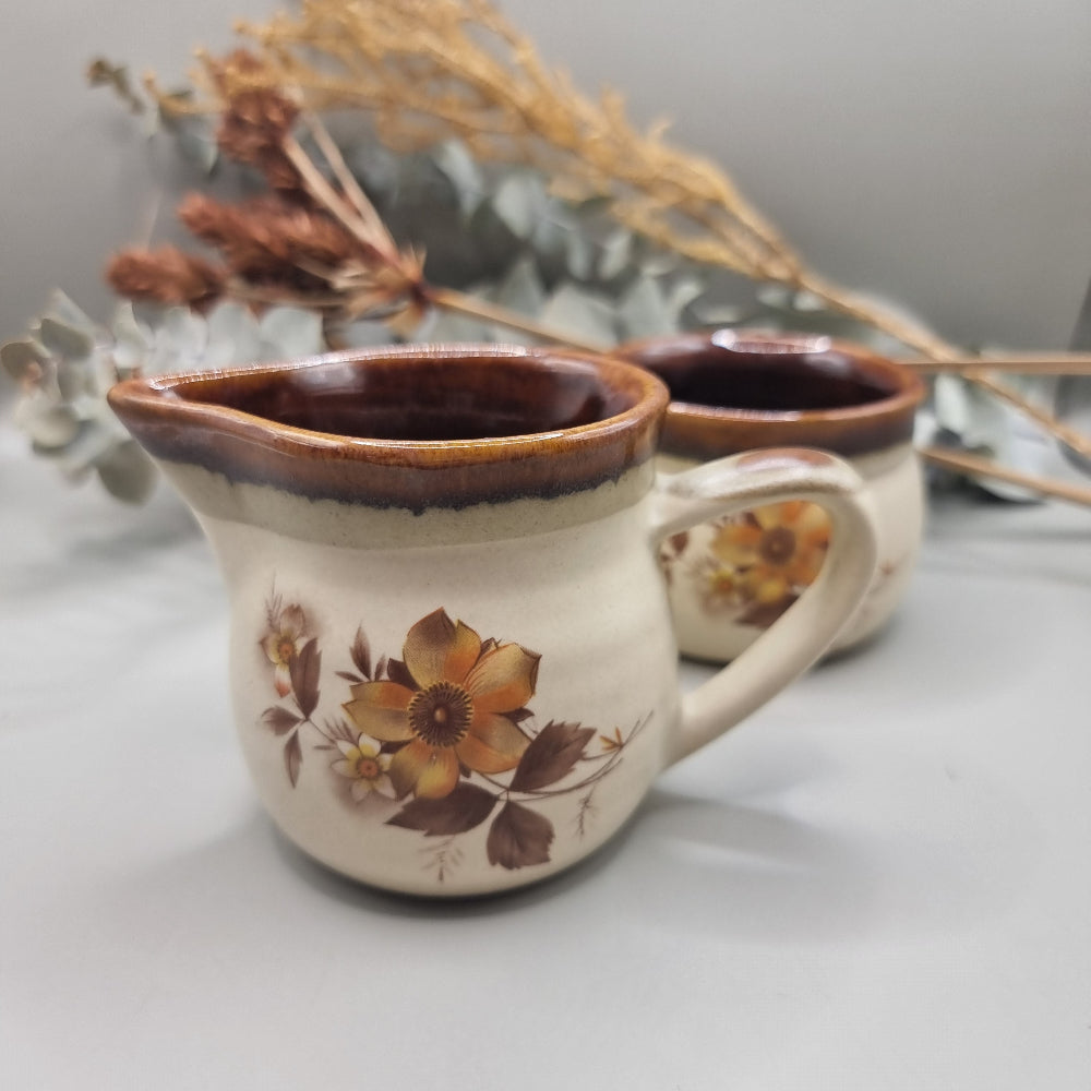 NZ stoneware creamer and sugar set with brown floral design and glaze rim