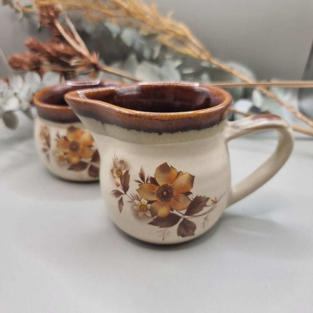NZ stoneware creamer and sugar set with brown floral design and glaze rim