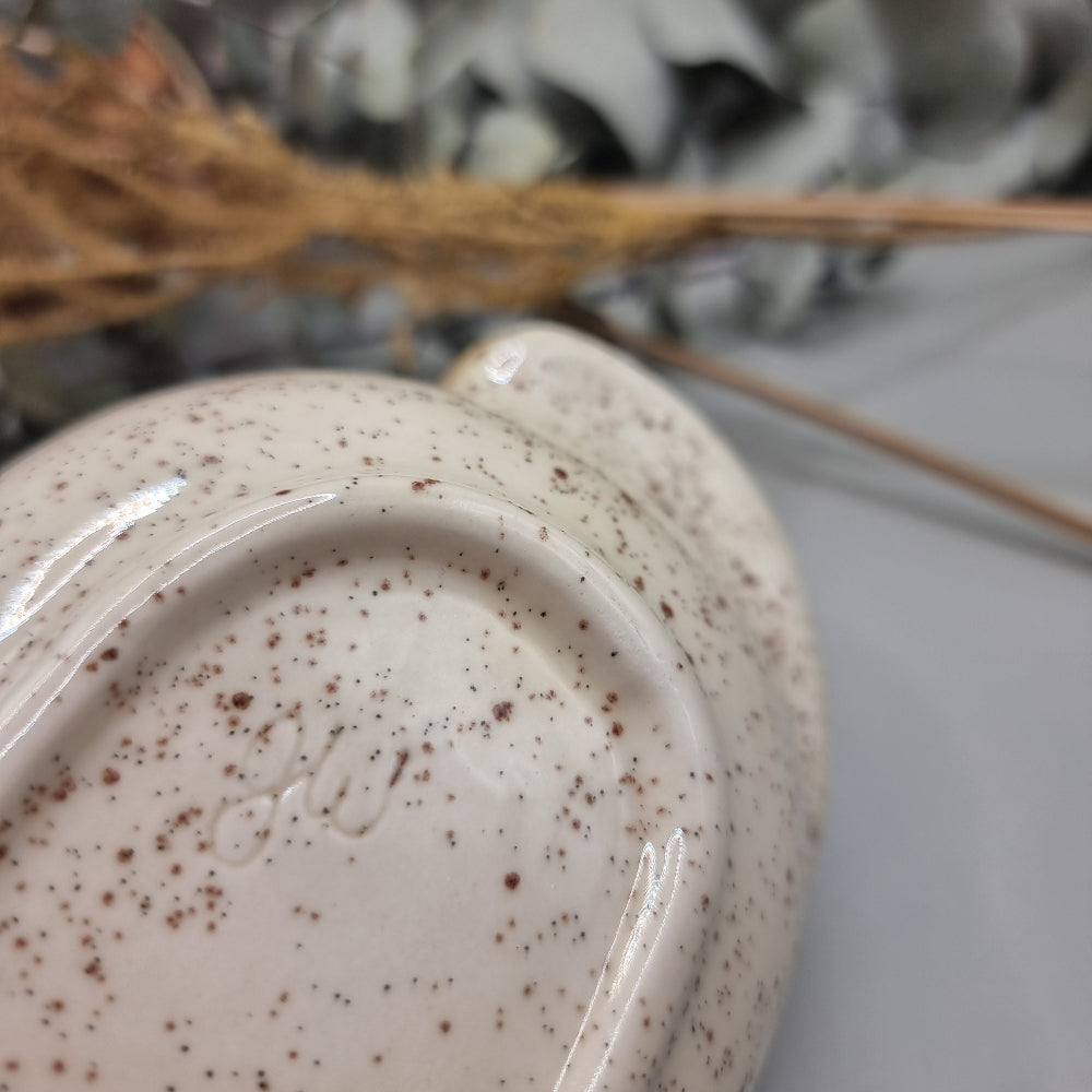 Rectangular speckled stoneware dish with brown glaze and yellow rose floral decals.