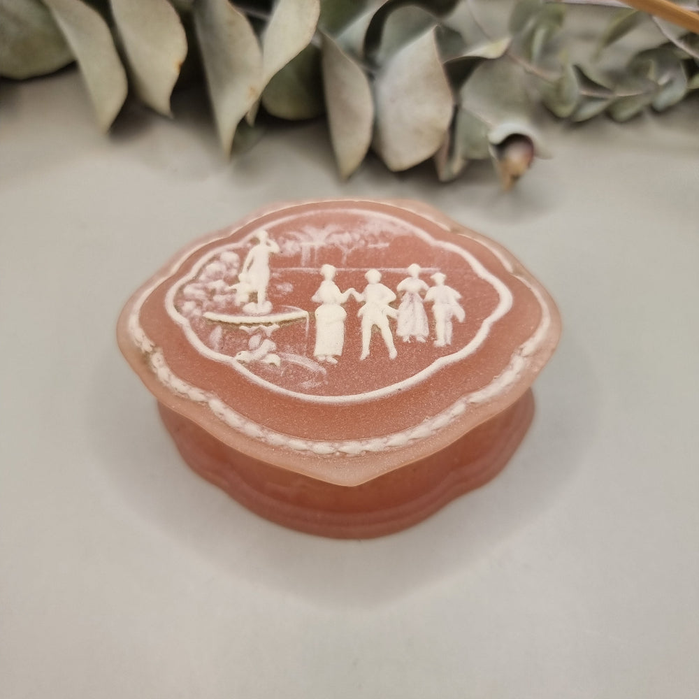 Pink vintage Marlestone trinket box with white classical cameo scene and hinged lid, made in New Zealand.