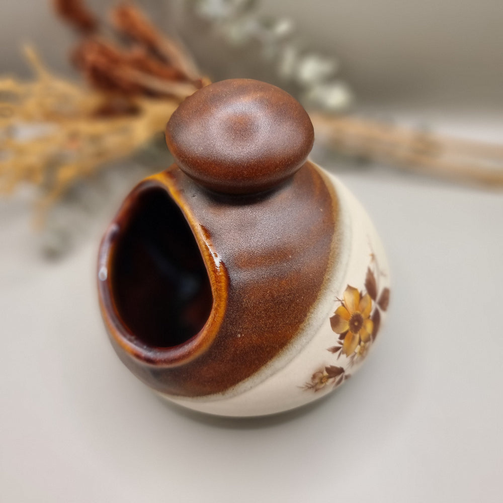 Royal Oak pottery salt pig with brown glaze and floral pattern