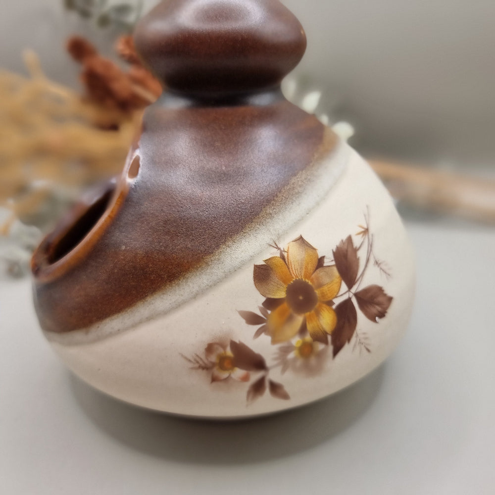 Royal Oak pottery salt pig with brown glaze and floral pattern