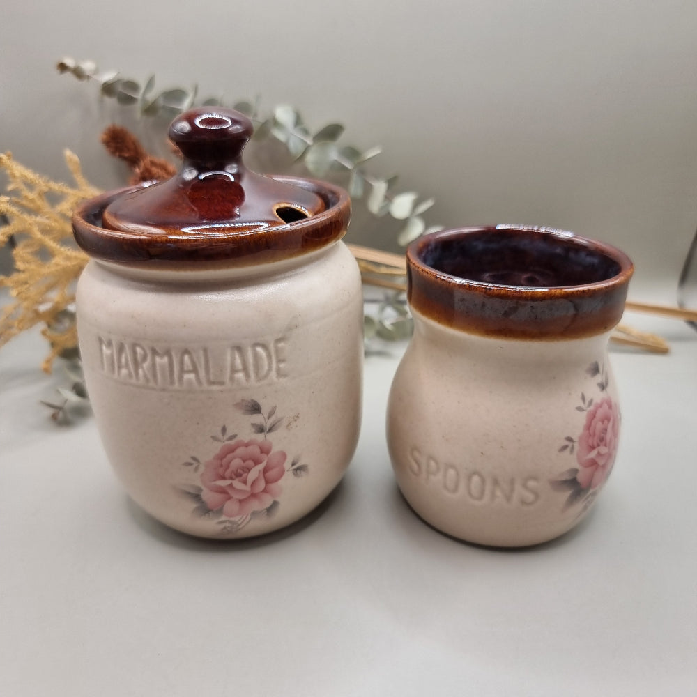 Ceramic marmalade jar and spoon holder with pink rose design and brown glazed rims.