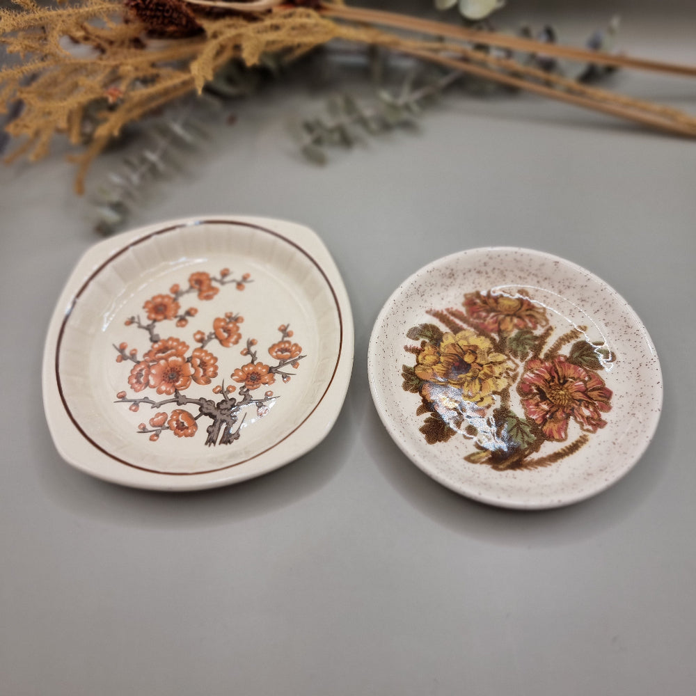Pair of Palissy dishes with floral designs – one speckled glaze, one Springtime blossom pattern.