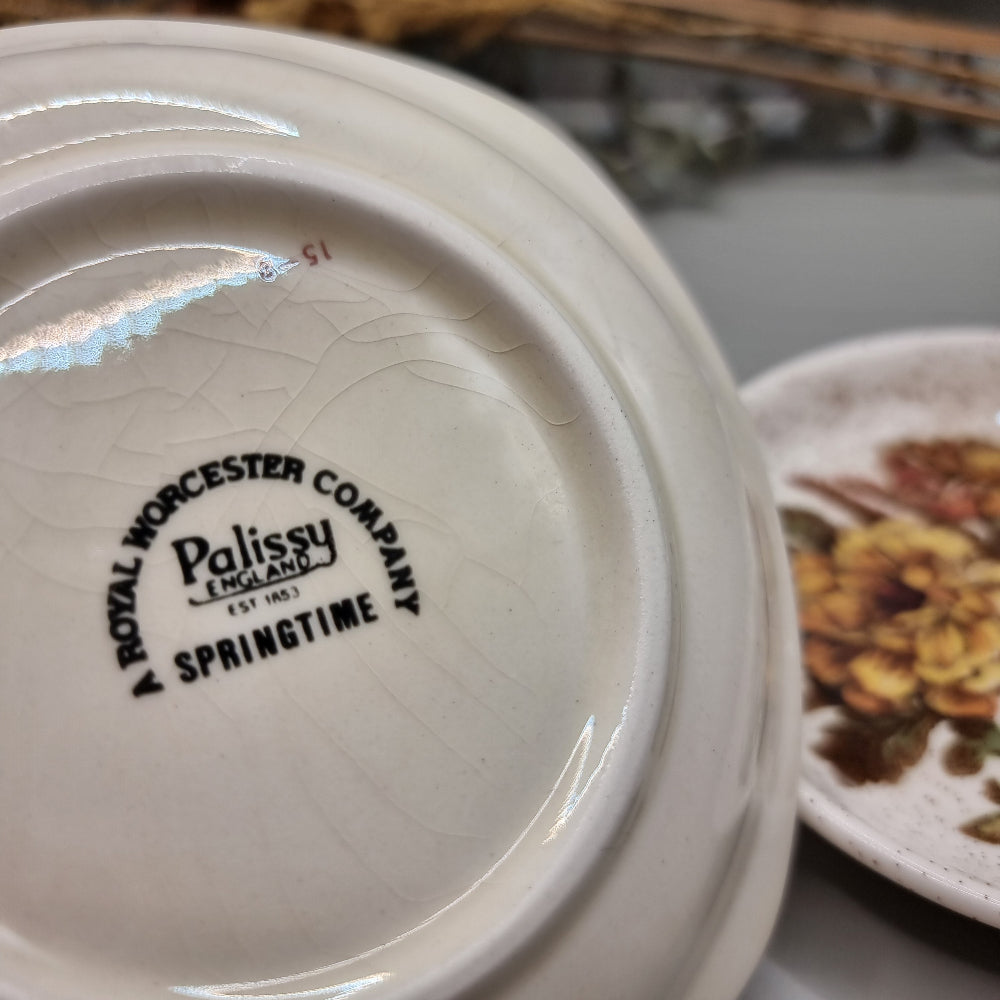 Pair of Palissy dishes with floral designs – one speckled glaze, one Springtime blossom pattern.