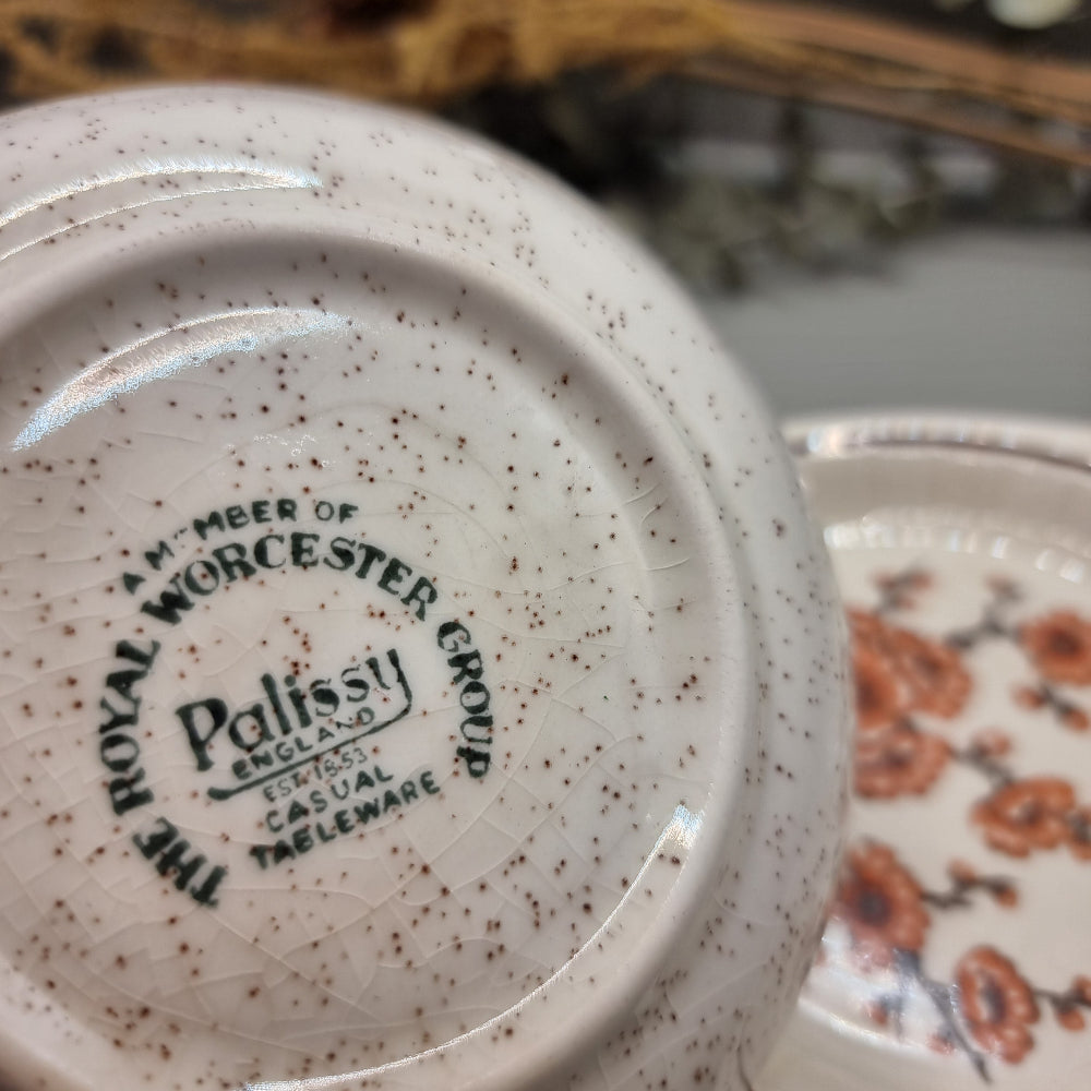 Pair of Palissy dishes with floral designs – one speckled glaze, one Springtime blossom pattern.