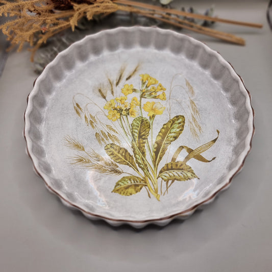 Vintage flan dish with yellow floral and barley design, scalloped edge