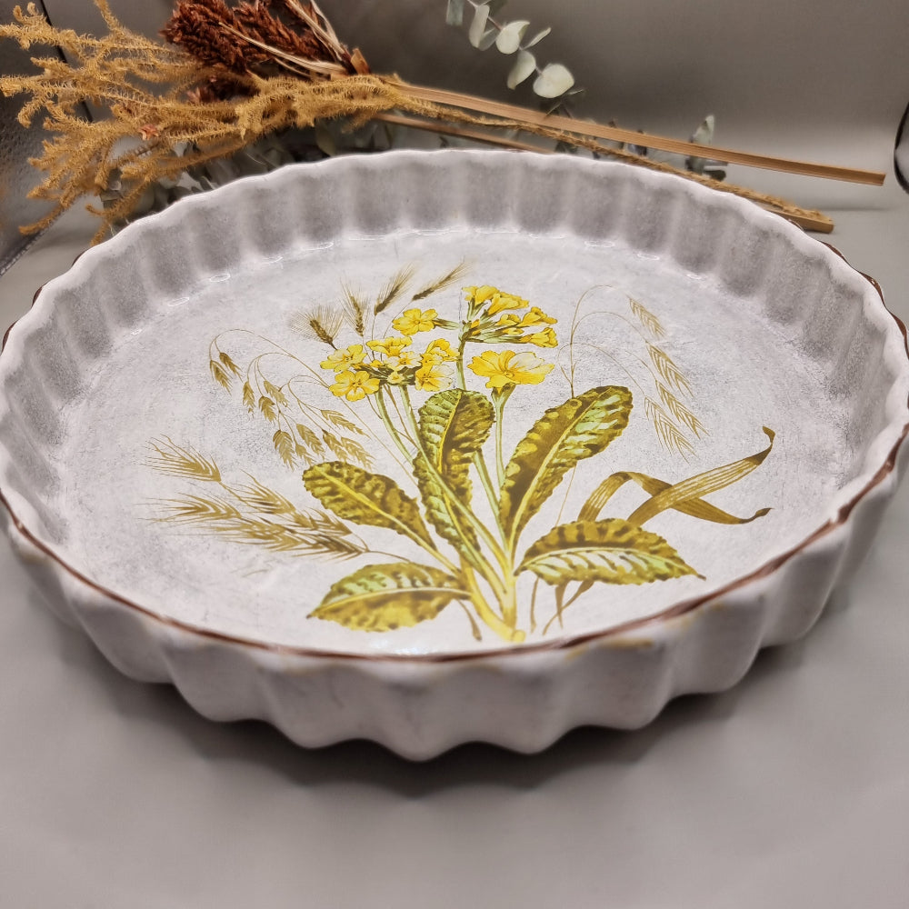 Vintage flan dish with yellow floral and barley design, scalloped edge
