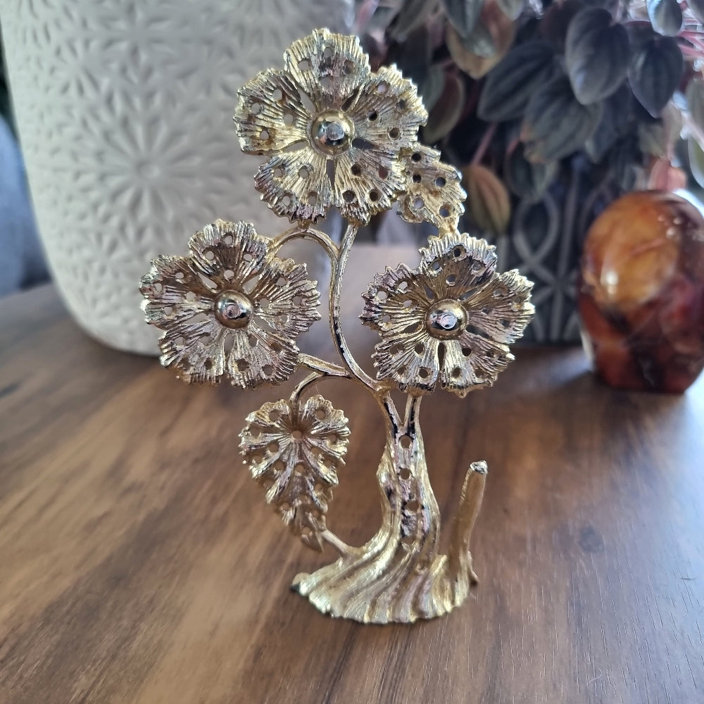 Vintage floral stud earring holder shaped like a blooming flower tree.