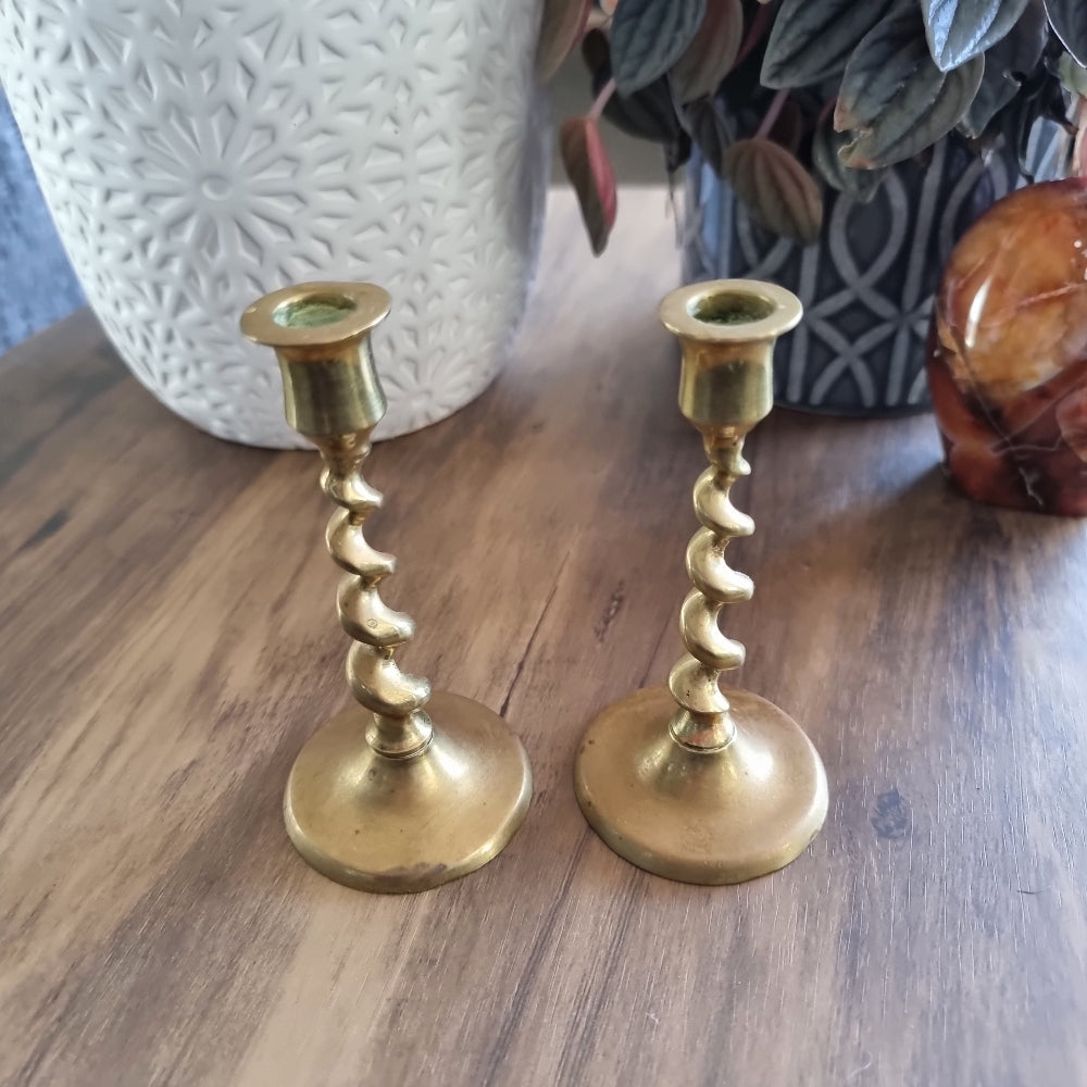 Pair of vintage brass candlesticks with twisted spiral stems.