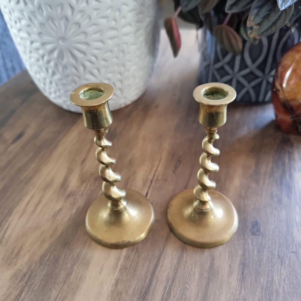 Pair of vintage brass candlesticks with twisted spiral stems.