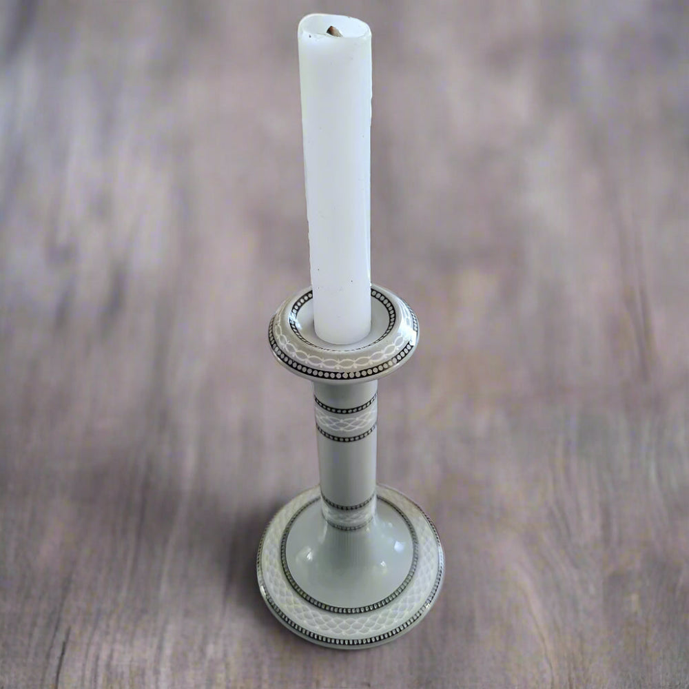 Grey ceramic candlestick holder with white and black geometric detail