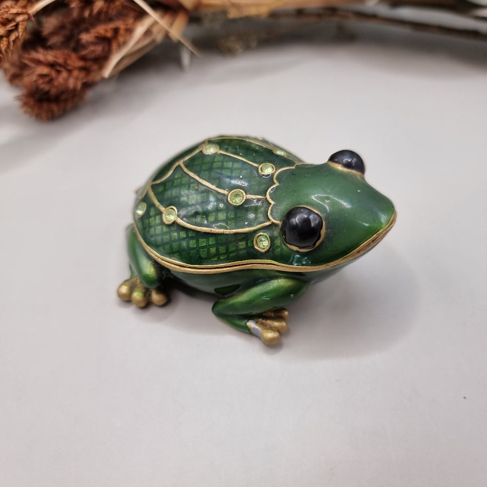Green enamel frog trinket box with gold trim and rhinestones.