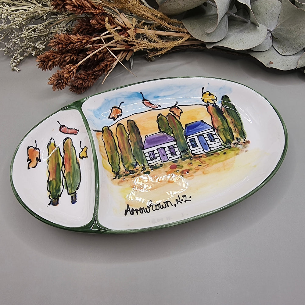 Hand-painted ceramic dish with Arrowtown cottages and autumn trees, signed Arrowtown, N.Z.