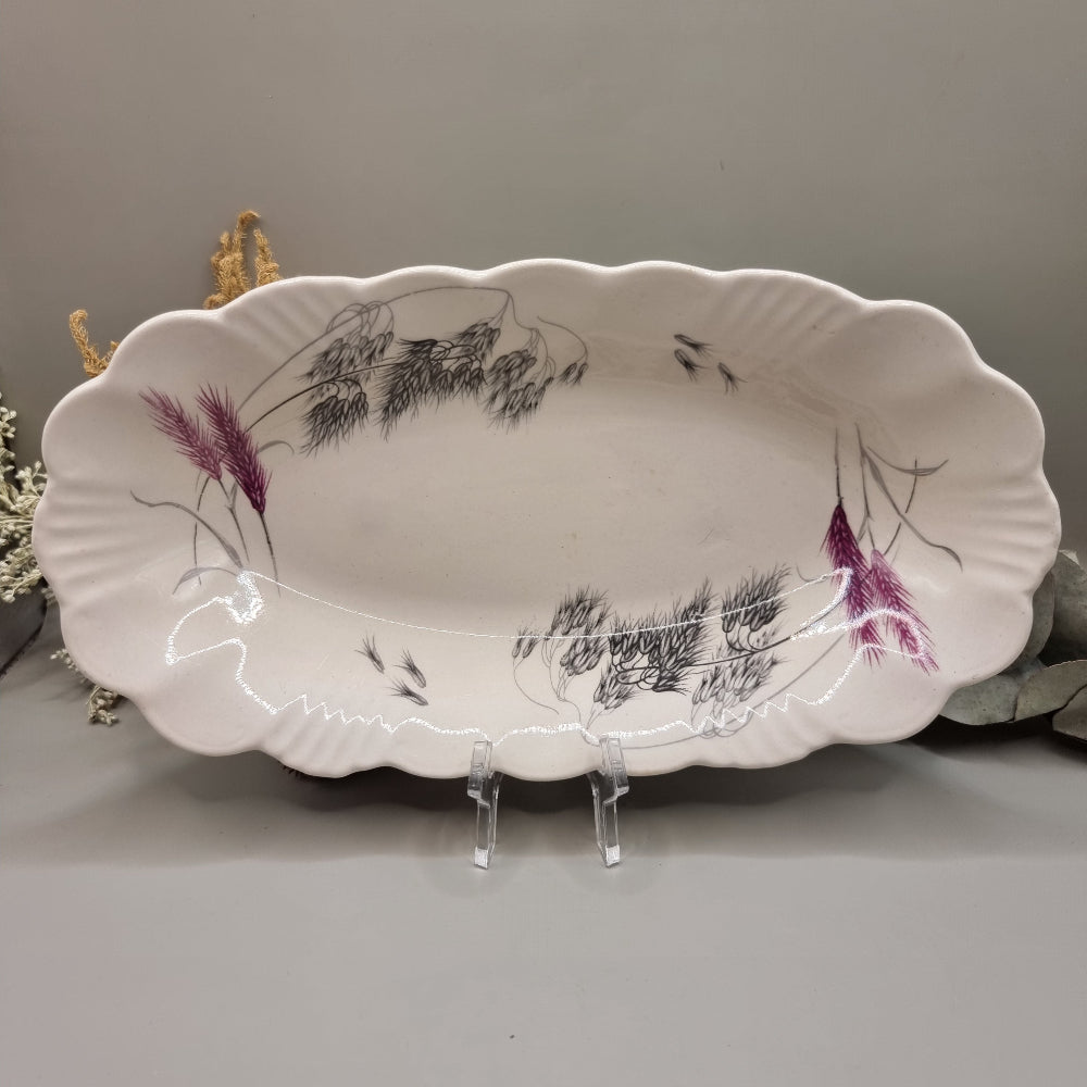 Clarice Cliff Royal Staffordshire oval dish with scalloped edge and wheat design in black, grey, and purple.