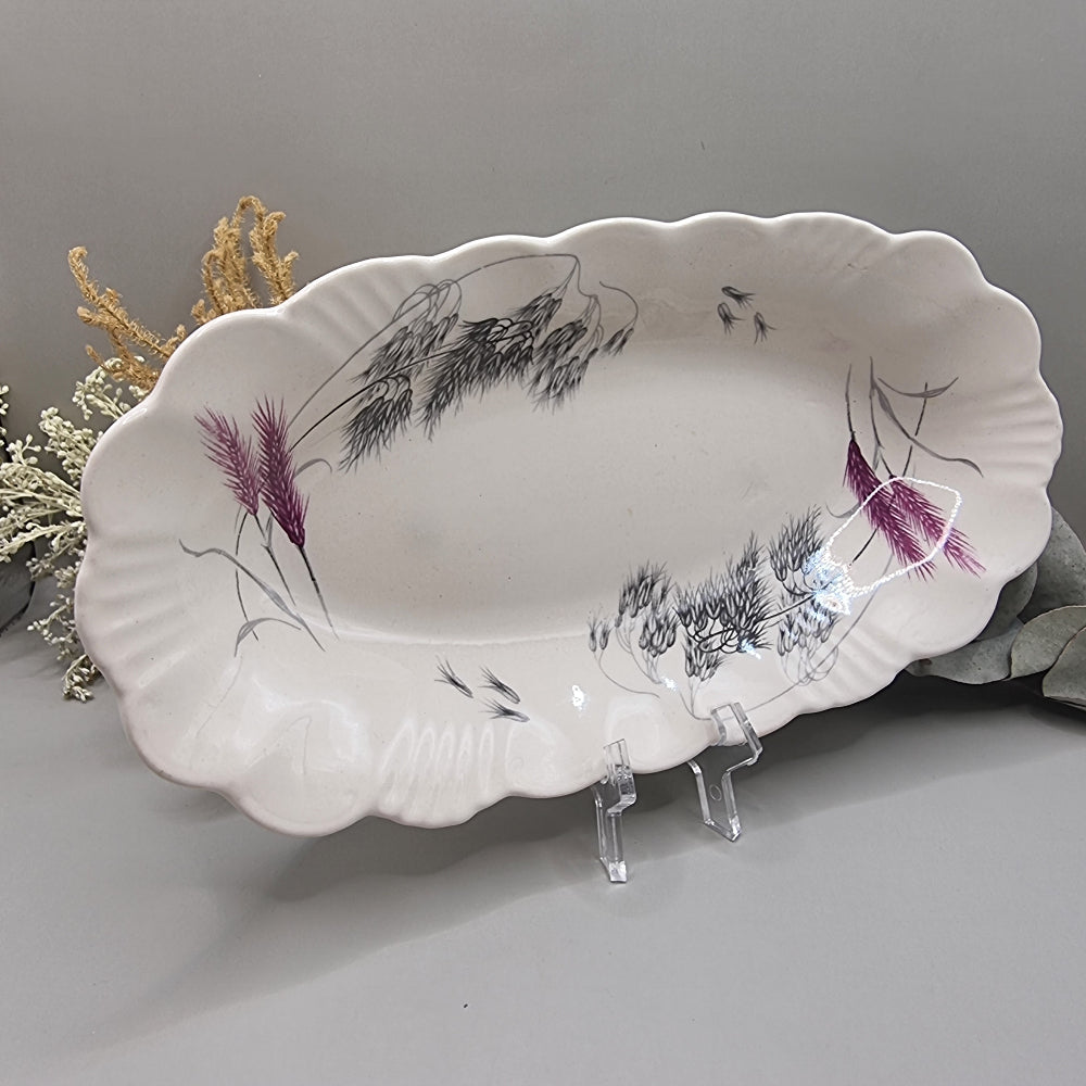 Clarice Cliff Royal Staffordshire oval dish with scalloped edge and wheat design in black, grey, and purple.