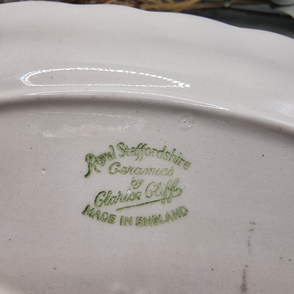 Clarice Cliff Royal Staffordshire oval dish with scalloped edge and wheat design in black, grey, and purple.