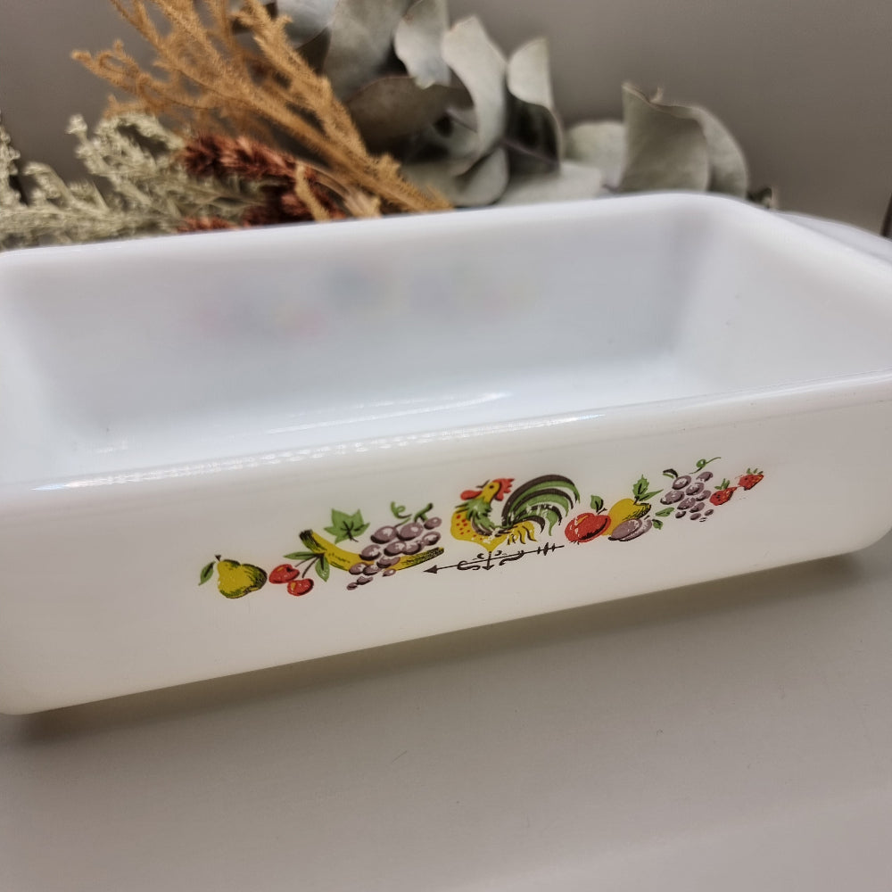 Vintage Anchor Hocking Fire-King loaf dish with rooster and fruit design on white milk glass
