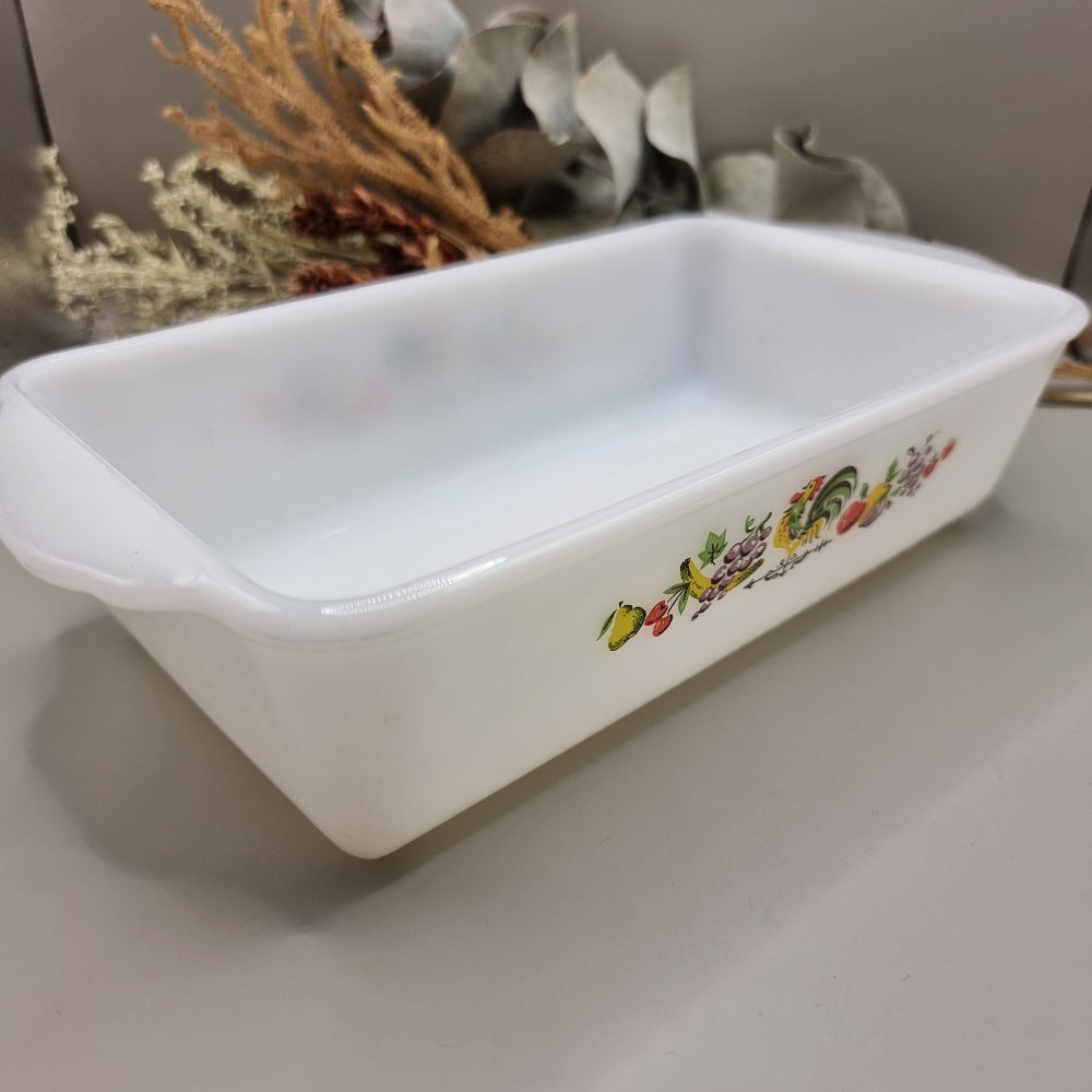 Vintage Anchor Hocking Fire-King loaf dish with rooster and fruit design on white milk glass