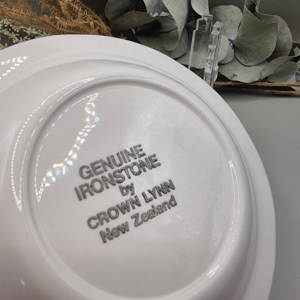 Crown Lynn ironstone plate with floral and strawberry bouquet, scalloped rim
