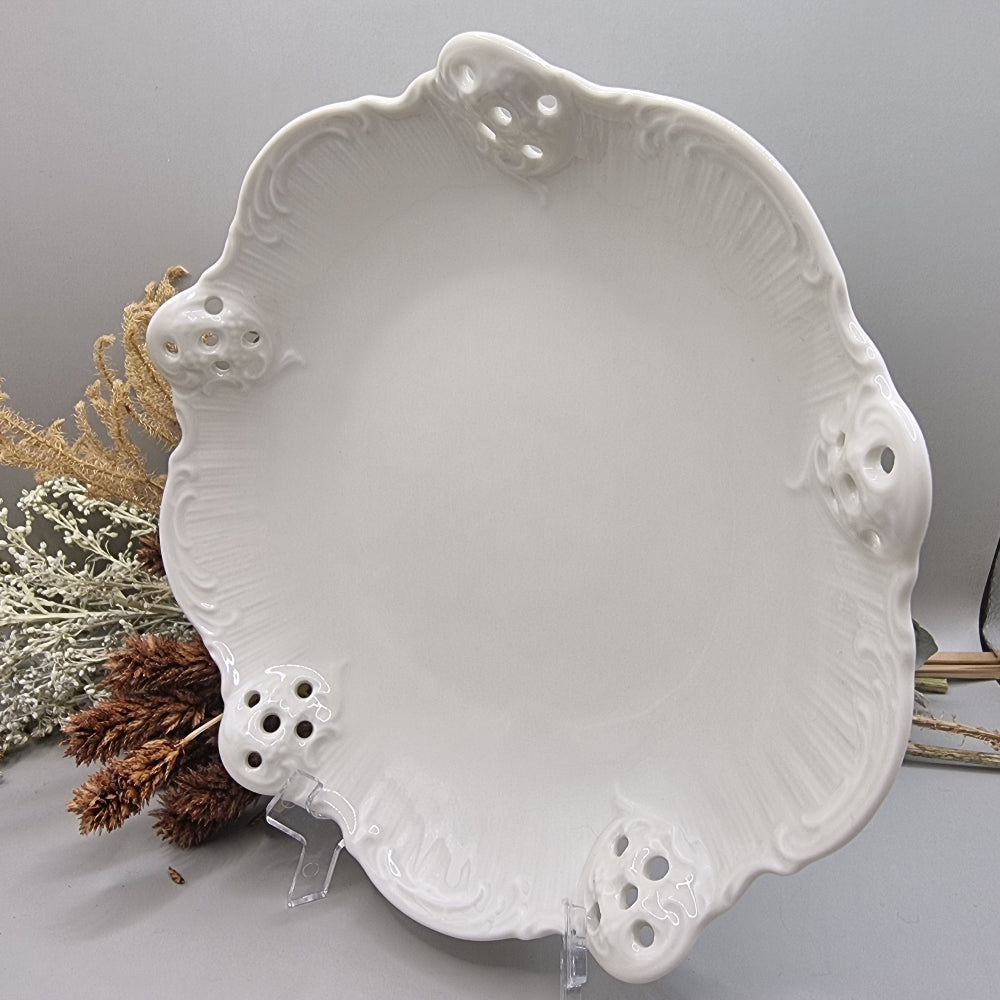 White Rosenthal Classic Rose porcelain dish with pierced edge and embossed scroll detail, made in Germany.