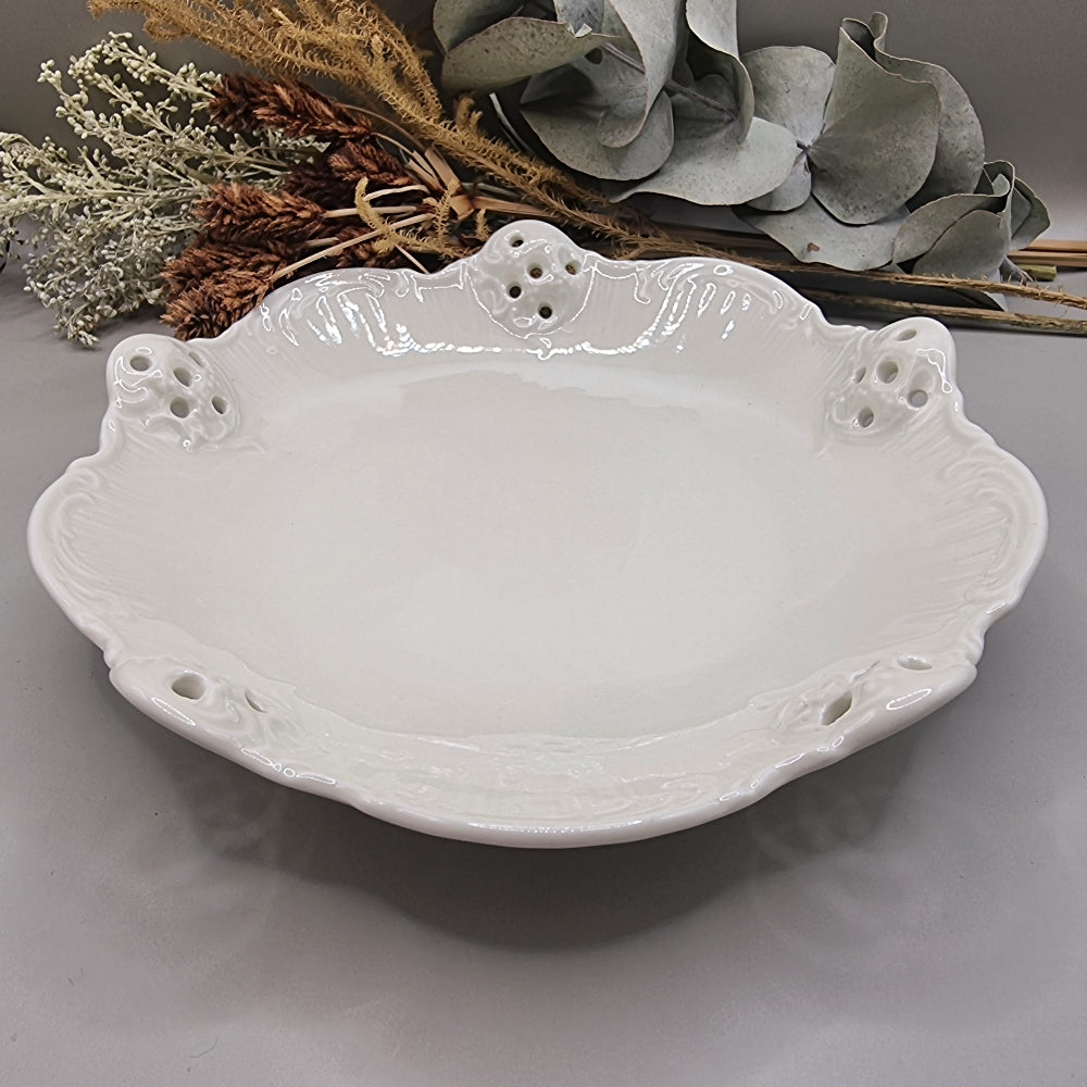 White Rosenthal Classic Rose porcelain dish with pierced edge and embossed scroll detail, made in Germany.