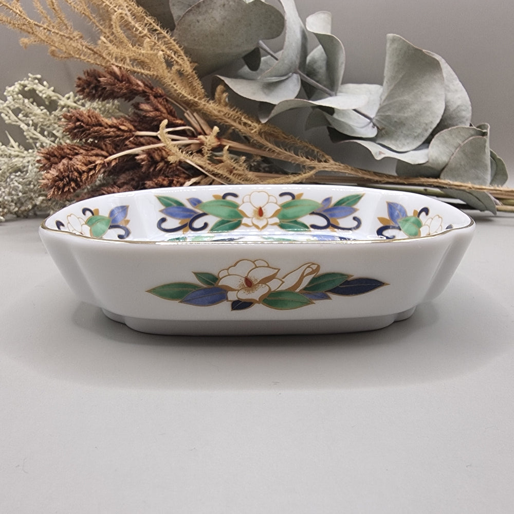 Chinese porcelain dish with colourful birds, green leaves, white flowers and gold trim.