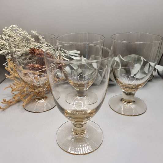 Set of four yellow depression glass goblets