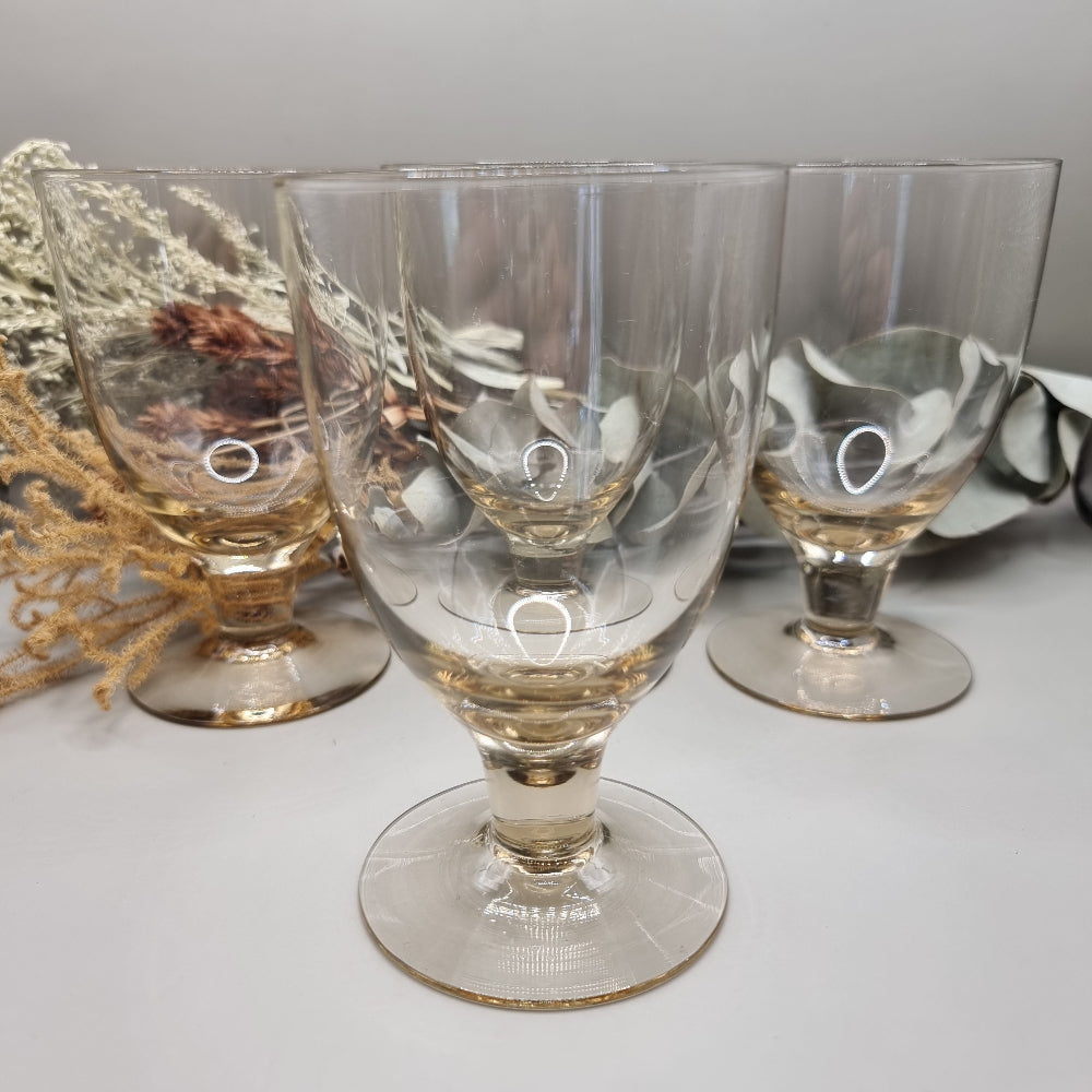 Set of four yellow depression glass goblets