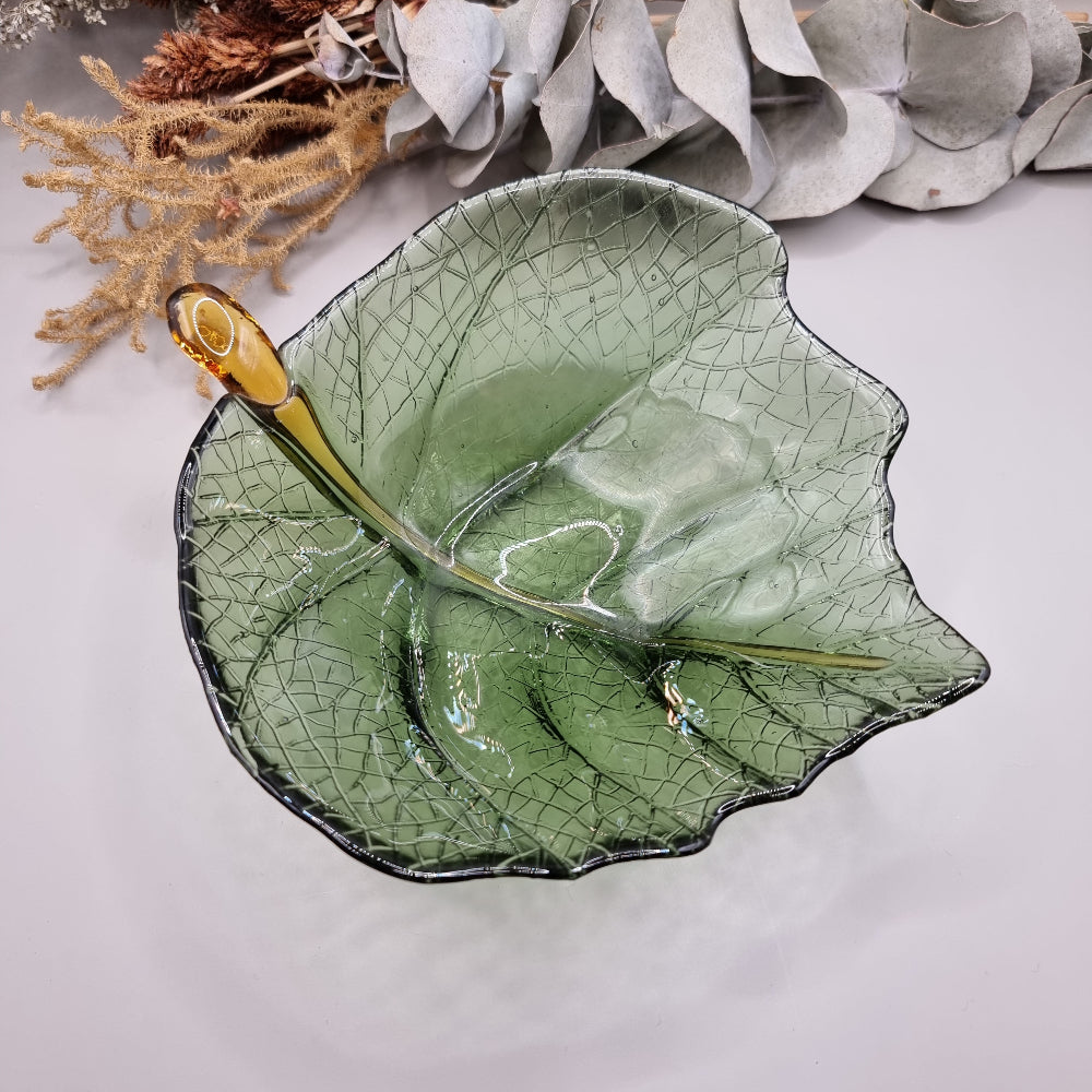 Green glass Dynasty Gallery olive leaf bowl and plate with gold stem detail.