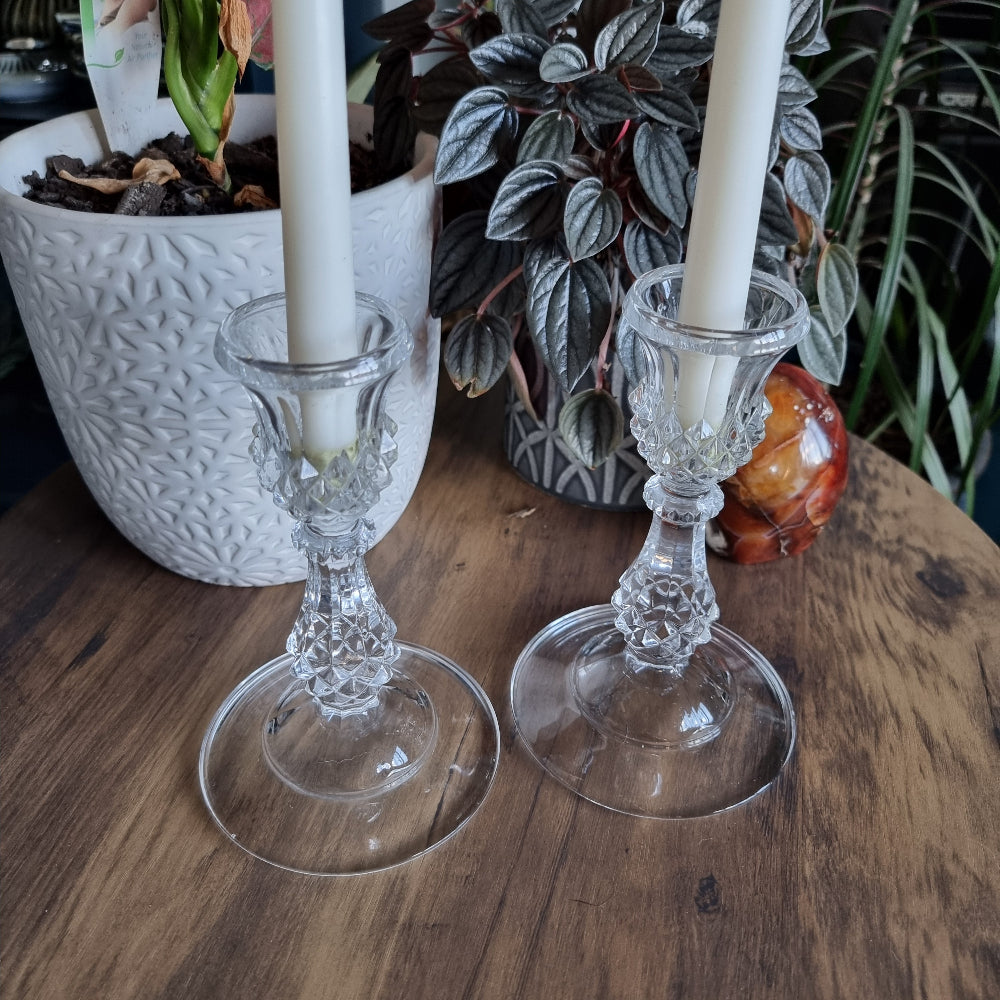 Pair of clear cut glass candlesticks with diamond pattern and flared base
