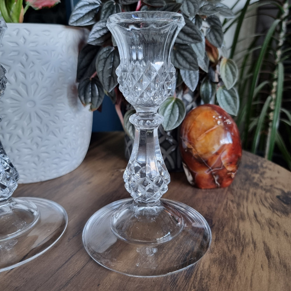 Pair of clear cut glass candlesticks with diamond pattern and flared base