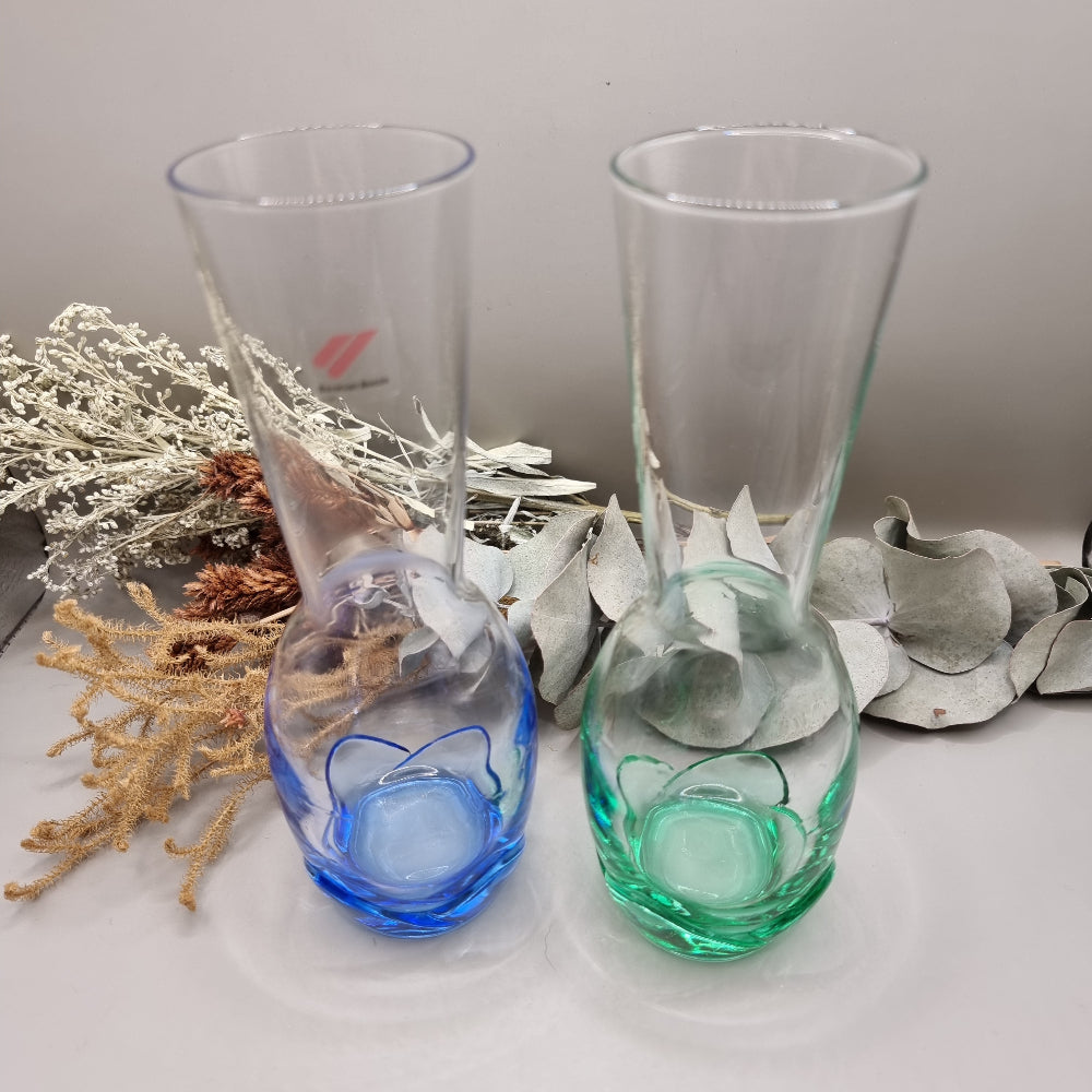 Pair of Bormioli Rocco glass vases with blue and green tinted bases.