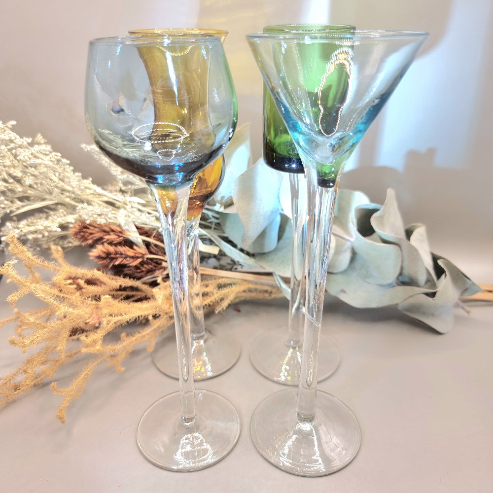 Set of four tall vintage coloured glasses with long stems