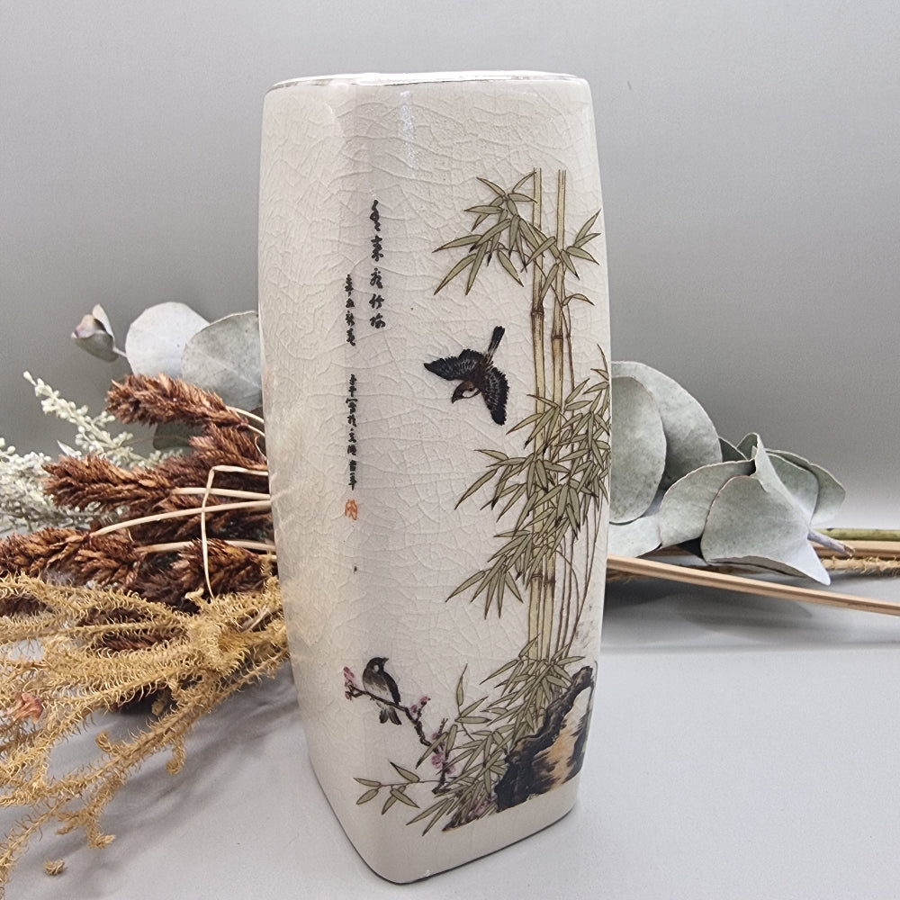 Vintage oriental-style ceramic vase with bamboo and bird design on crackle glaze.