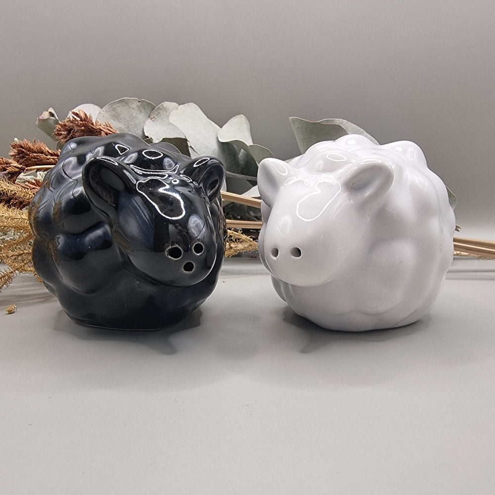 Black and white ceramic sheep salt and pepper shakers in glossy finish.