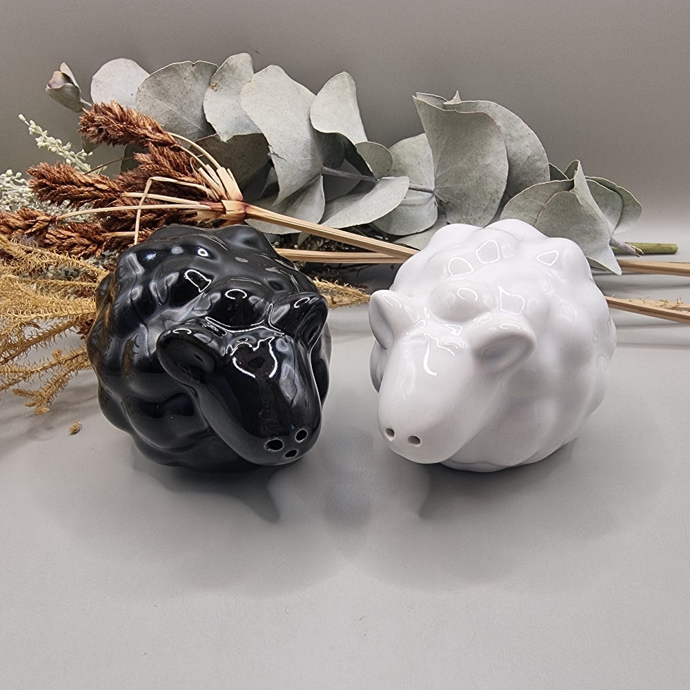 Black and white ceramic sheep salt and pepper shakers in glossy finish.