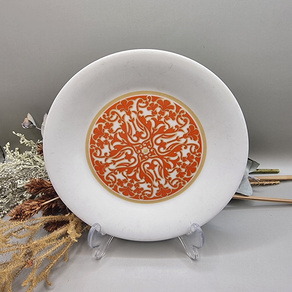 Royal Doulton Seville plate with orange and gold ornate central design.