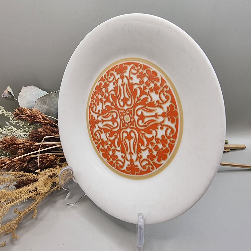 Royal Doulton Seville plate with orange and gold ornate central design.