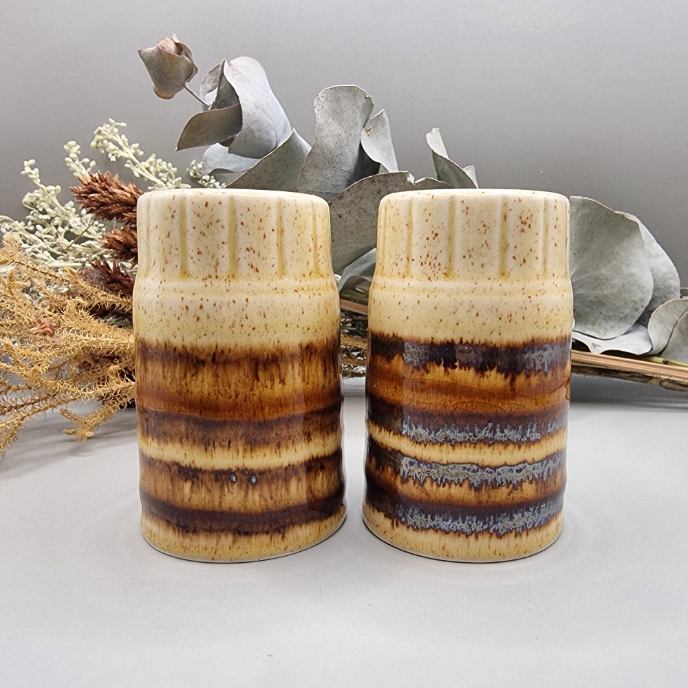 Set of two brown drip glaze ceramic salt and pepper shakers, made in England.