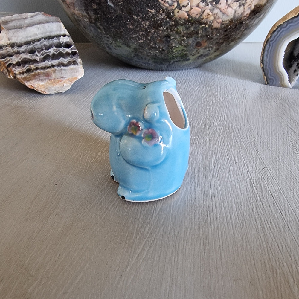 Vintage blue ceramic hippo toothpick holder with floral detail and open back cavity