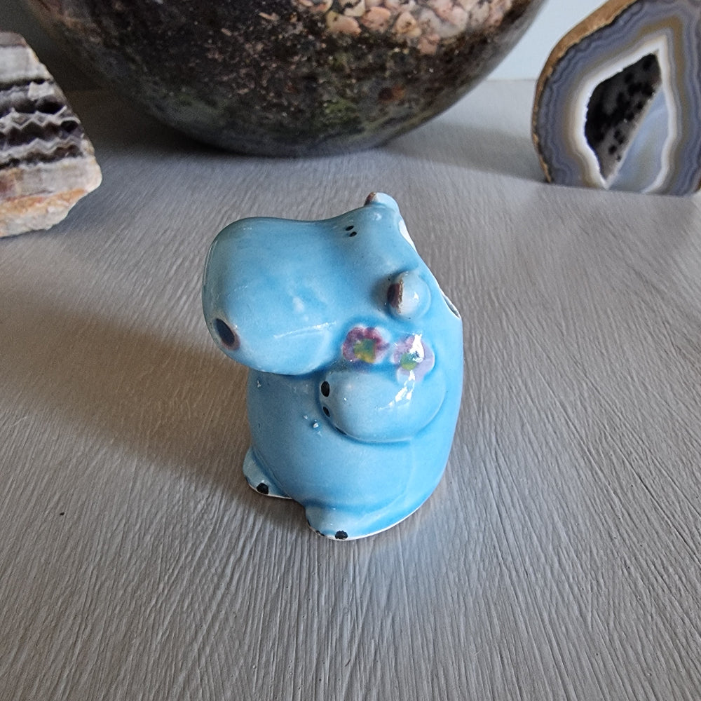 Vintage blue ceramic hippo toothpick holder with floral detail and open back cavity