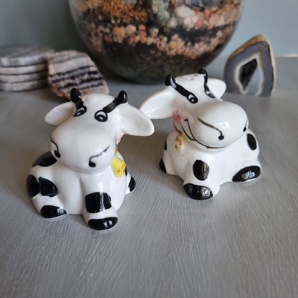 Ceramic cow salt and pepper shakers with black spots and yellow cowbells