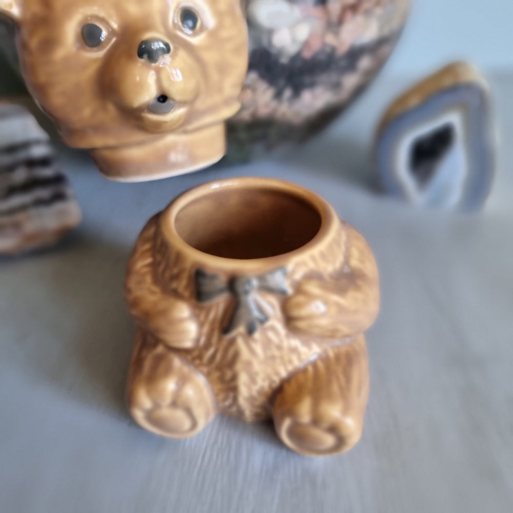 Vintage ceramic bear honey pot with bowtie and removable head for storing honey.
