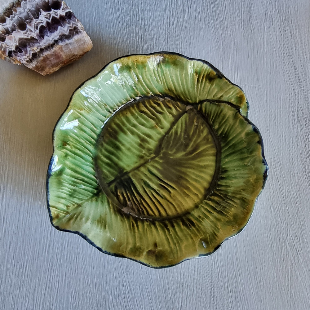 Vintage green majolica-style cabbage leaf dish with textured veining and ruffled edge