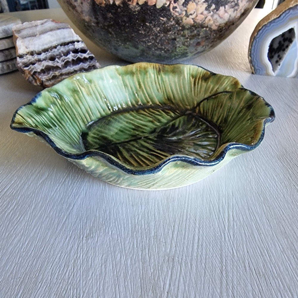 Vintage green majolica-style cabbage leaf dish with textured veining and ruffled edge